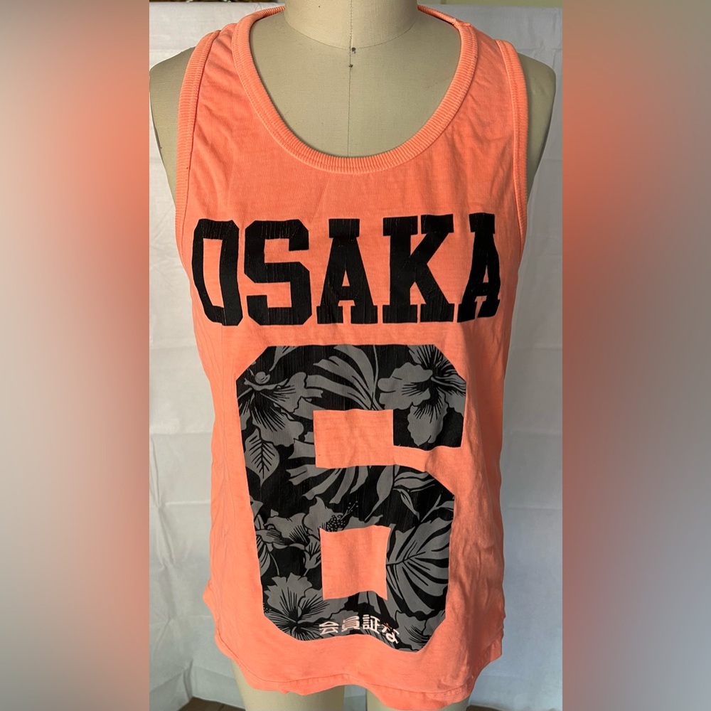 Superdry . Men’s medium but fits small. Neon orange.